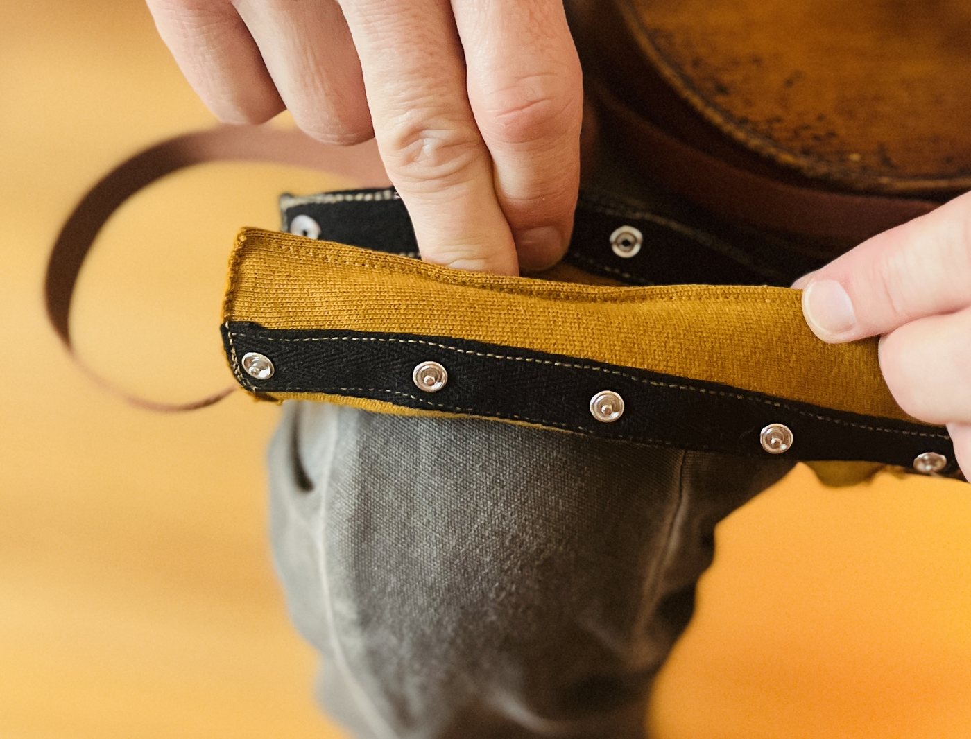 Handcrafted buckle and padding detail